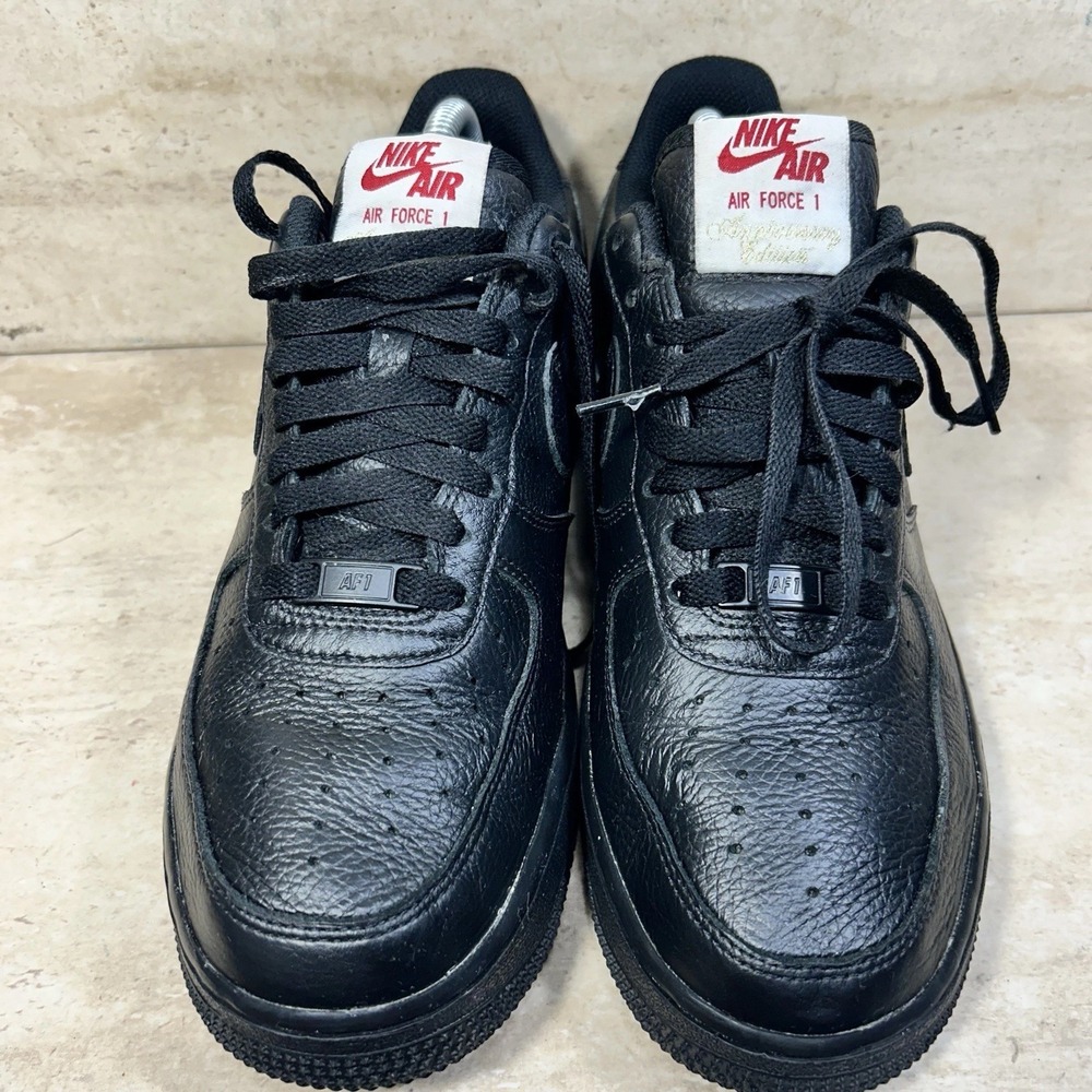 Nike Air Force 1 Low Anniversary Edition Black Tumbled Leather Red Logo Sneaker